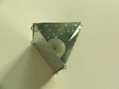 STEP 3: Connecting 3-by-5-inch plates into a triangle shape makes a perfect cover for a narrow votive candle. The taller 3-by-9-inch plates, connected into a four-sided column, are a good fit with a pillar or a short taper candle.
